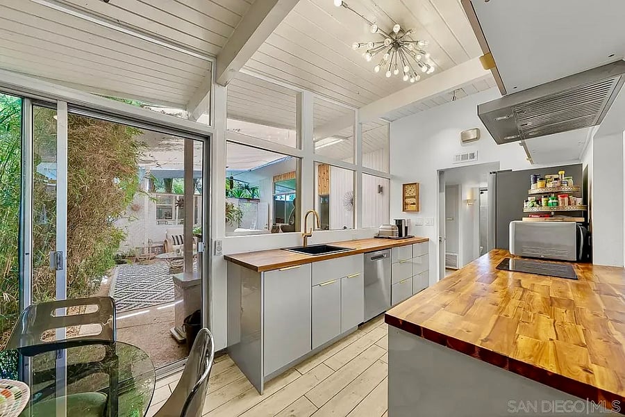 A beautifully appointed kitchen overlooks the private atrium.