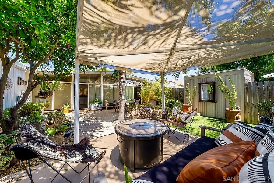 Surrounded by lush tropical gardens, the backyard feels like a private resort.