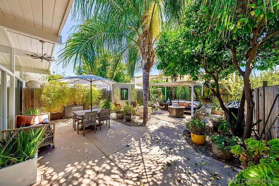 Every view is framed by mature landscaping and vibrant greenery.