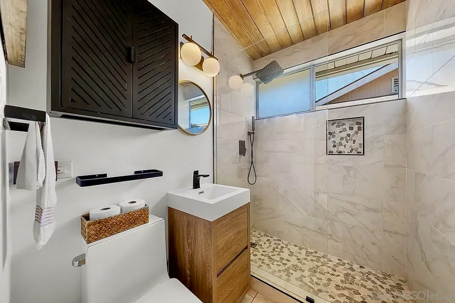 A bright, modern bathroom with a spacious walk-in shower.