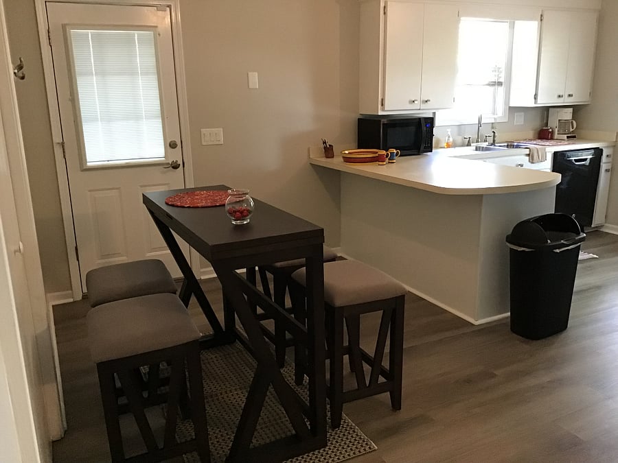 Kitchen area.  Table expands to seat up to 6;  6 stools are provided.