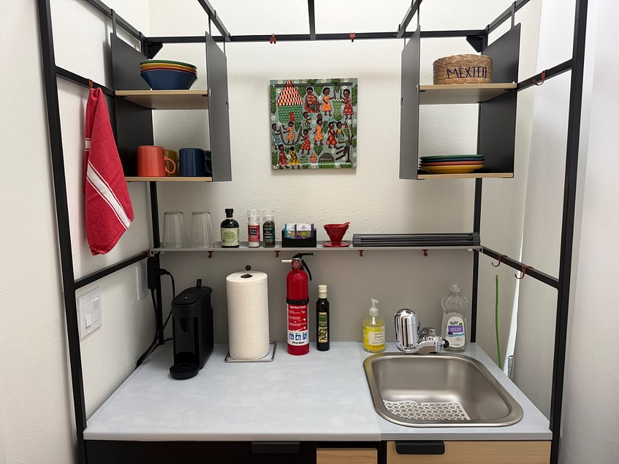 Kitchenette includes 3' mini fridge, microwave, hot plate, Keurig coffee maker, and PUR water filter. Toaster oven available by request.
