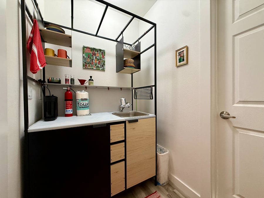 Kitchenette is adjacent to the laundry room.