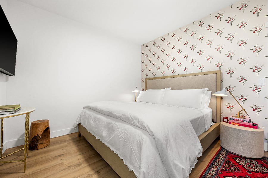Second bedroom with king bed and 55 inch smart tv