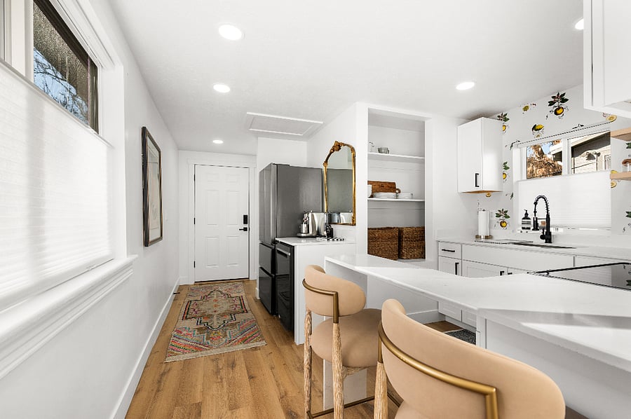 Kitchen with seat up bar and stools