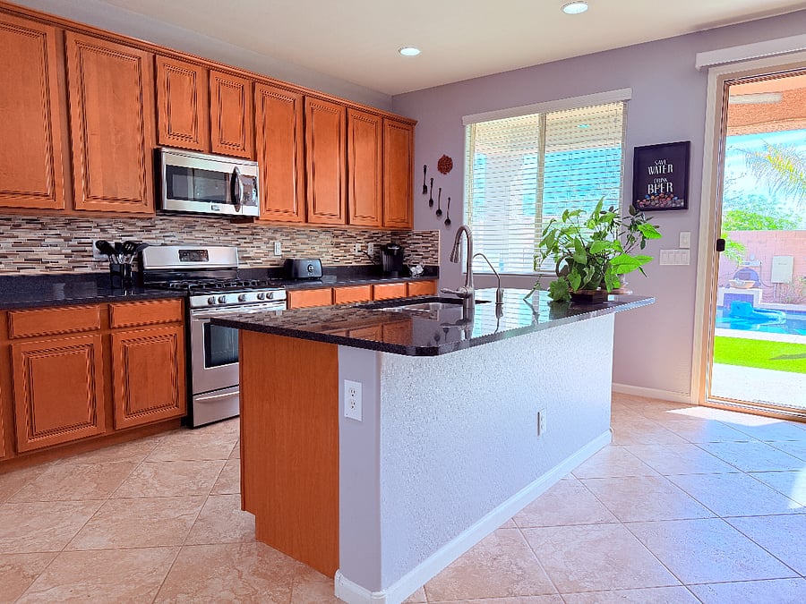 Shared kitchen with all the basics included. It also leads you to our beautiful backyard!