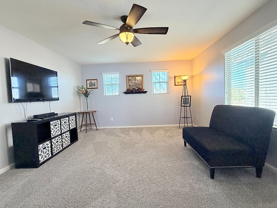 Shared loft with a large TV and Apple TV.