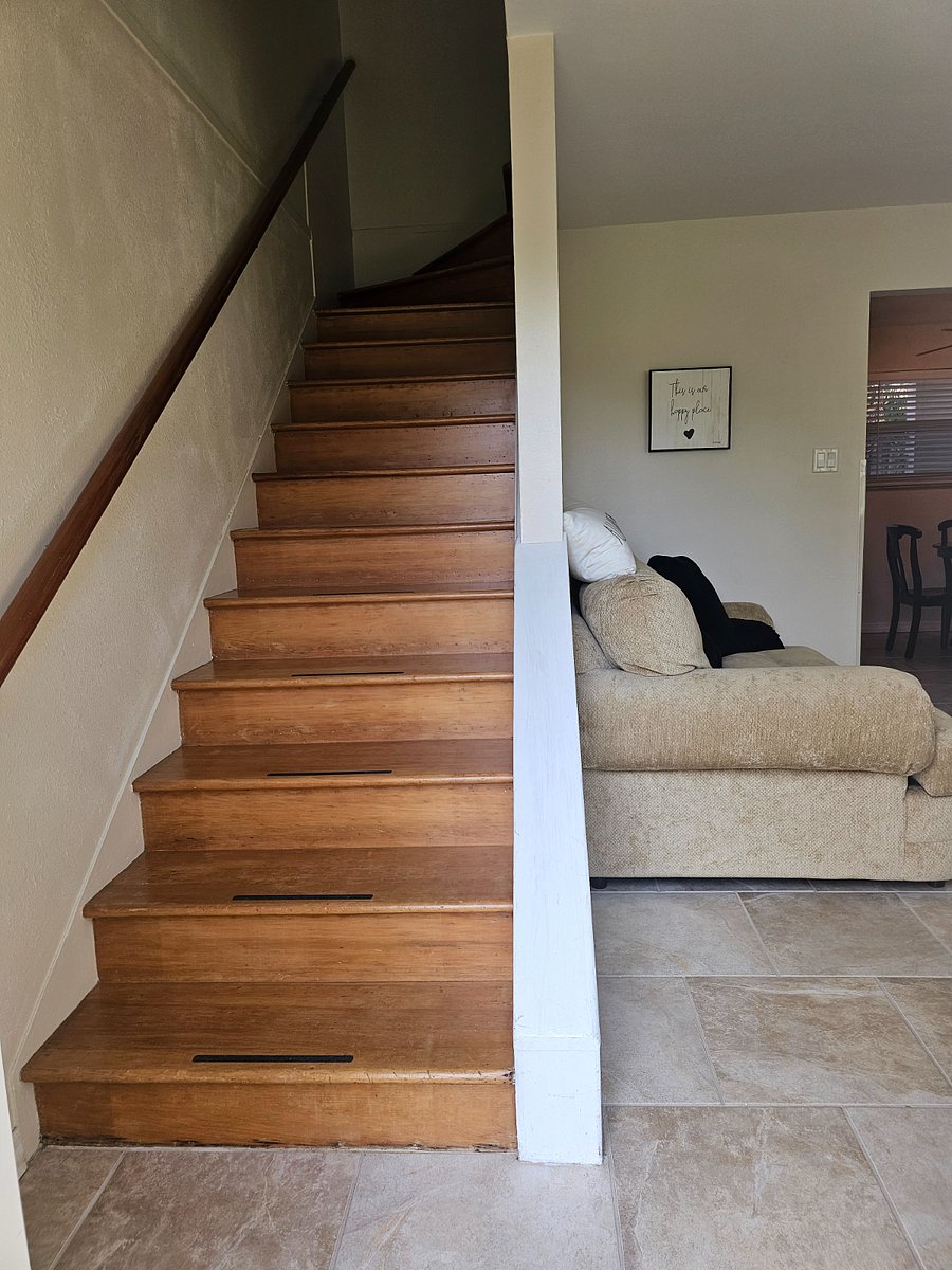 Living room, and stairs to the upper level