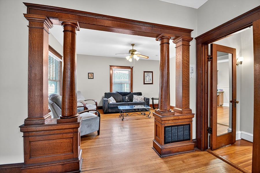 Cozy Omaha living area featuring classic wood paneling and warm natural light.