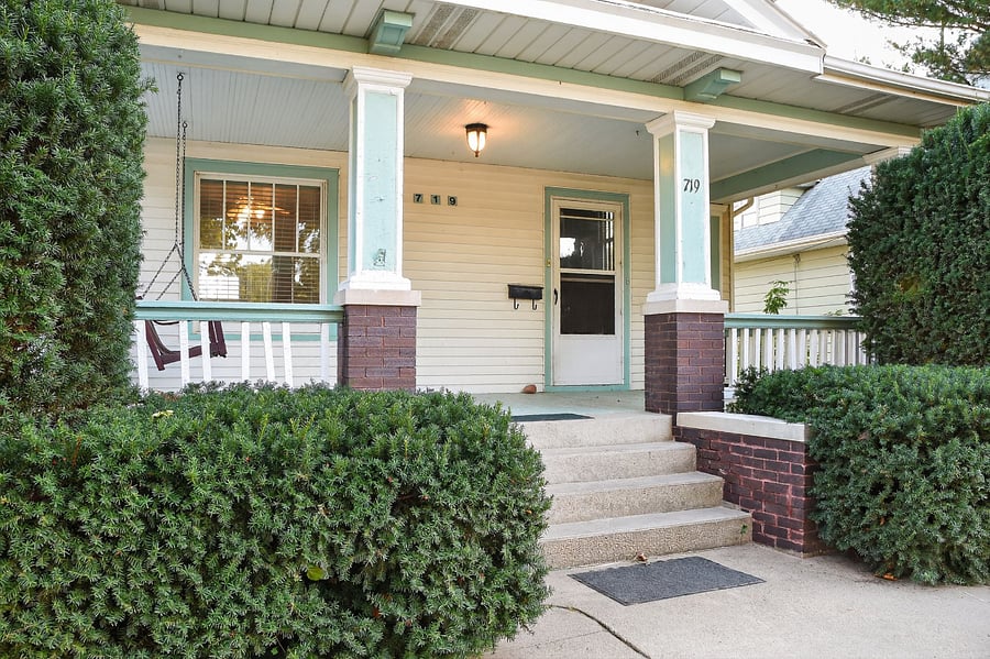Spacious family friendly rental with authentic wooden exterior and peaceful neighborhood vibes.