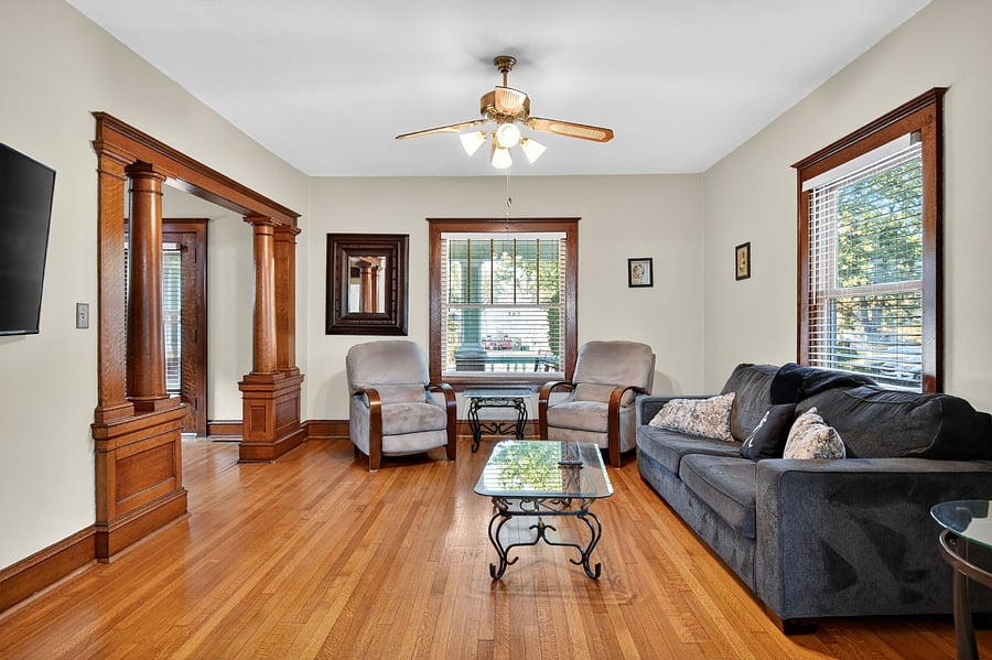 Inviting living room with rich wooden interiors and plenty of space to unwind.