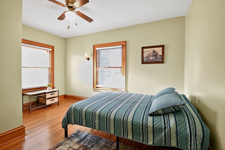 Cozy Omaha bedroom with timeless wooden accents and homely comfort.