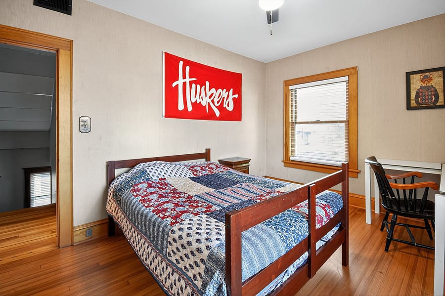 Perfect family bedroom featuring soft lighting and traditional wooden dcor.