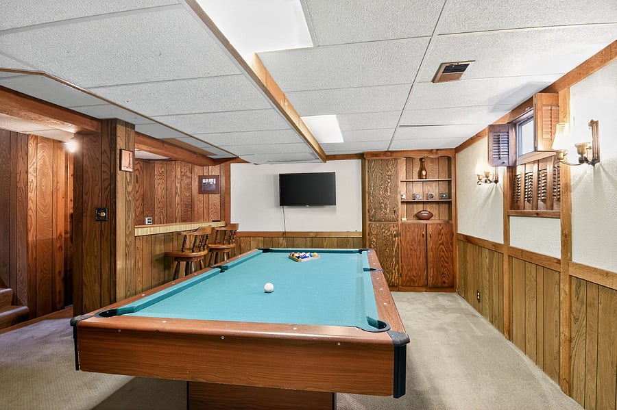 Have fun indoors with a classic pool table in this Omaha home.