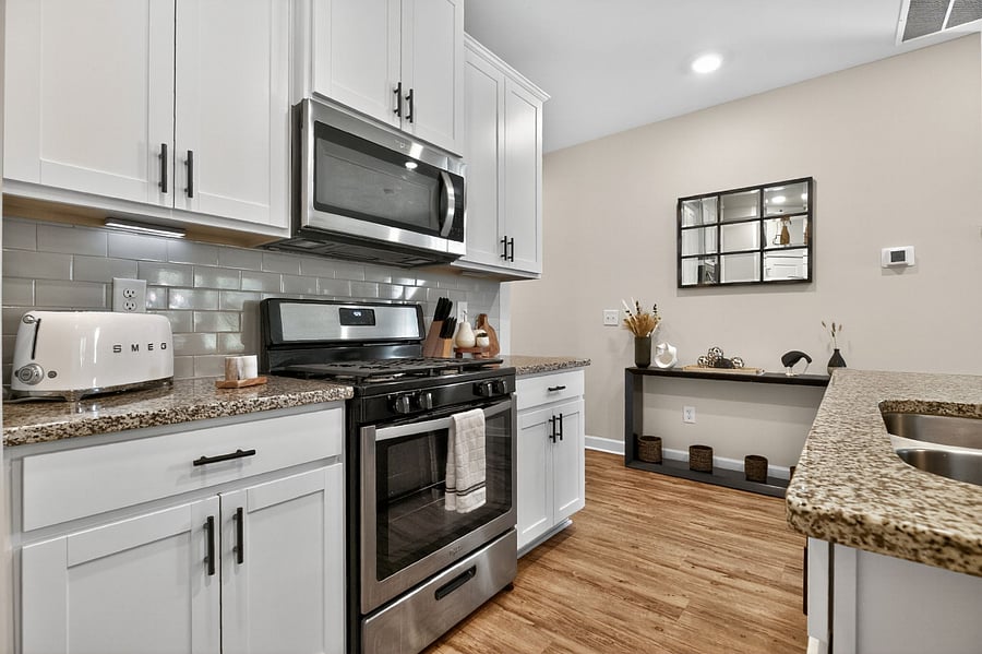Cook with ease in this bright, functional kitchen. Complete with stainless steel appliances, cookware, and all your coffee essentials.