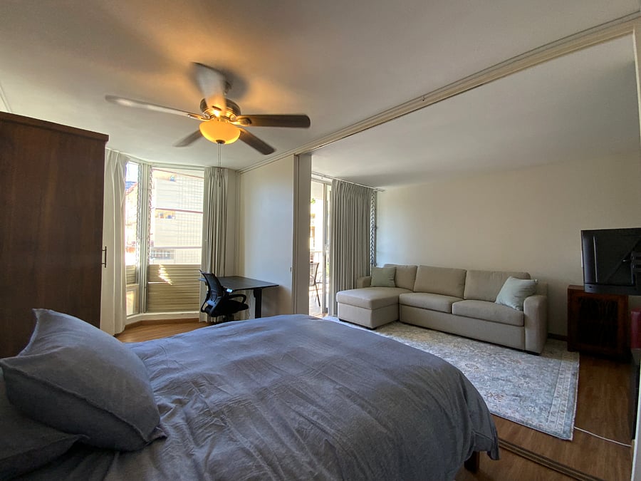 SLIDING DOORS SEPARATE LIVING ROOM AND BEDROOM