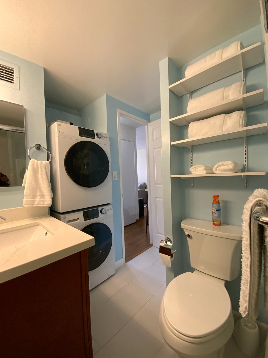 NEW WASHER AND DRYER IN BATHROOM