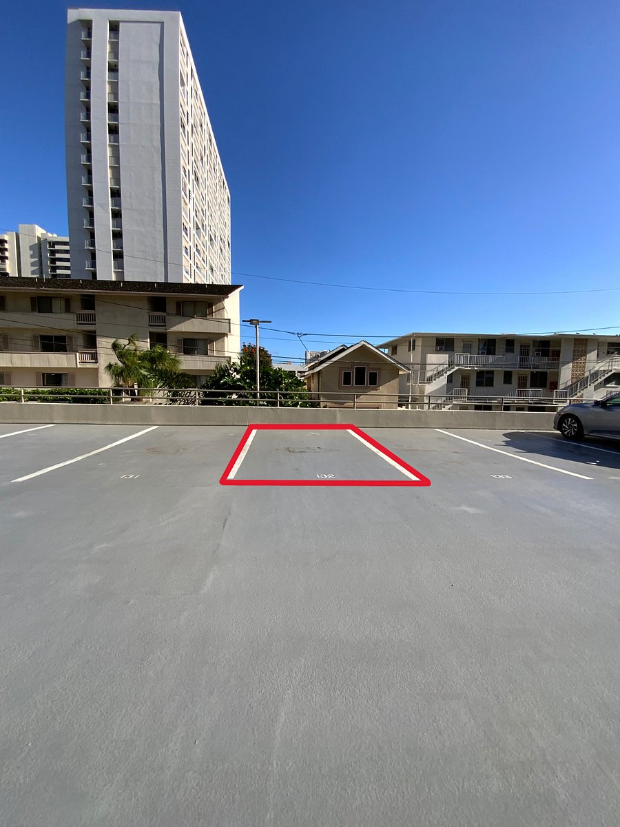 1 ASSIGNED OPEN PARKING STALL IN LOT AT BUILDING