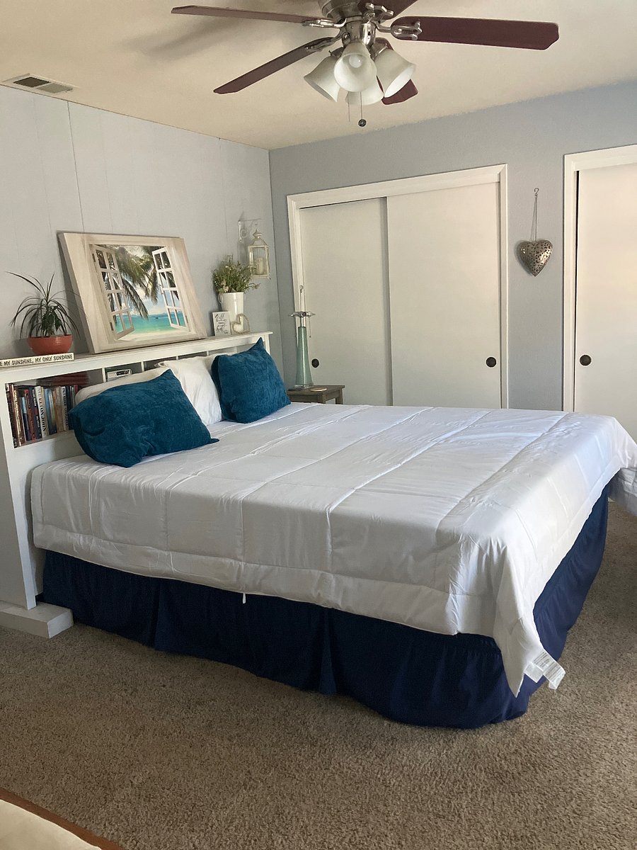 Master bedroom with California king mattress with foam top if wanted.