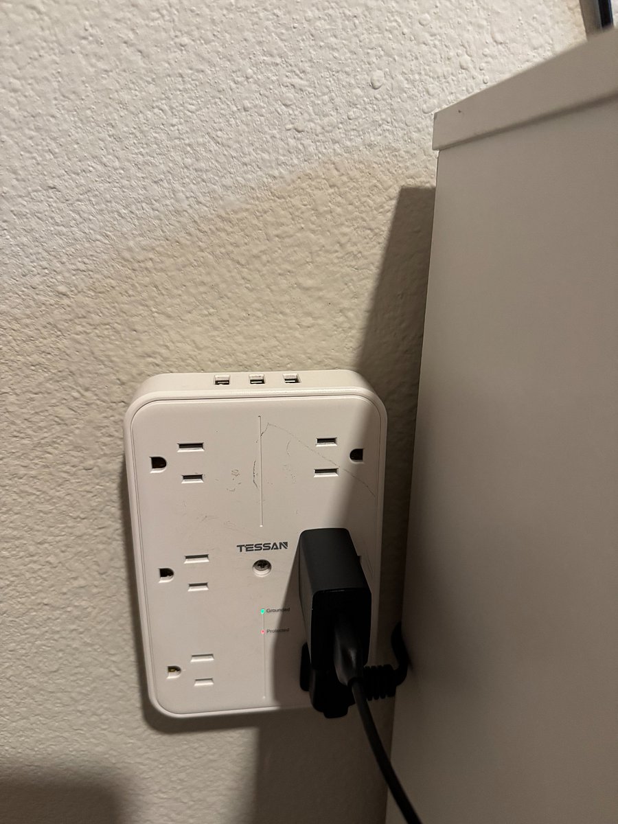 Multi-outlet with USB charging ports for electronics.