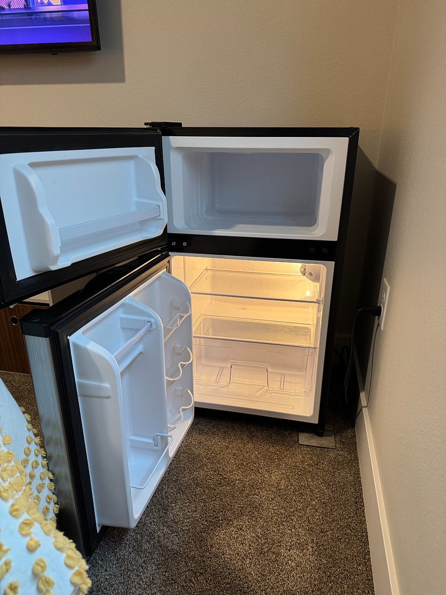 Mini-fridge for convenience and added space for personal refreshments.