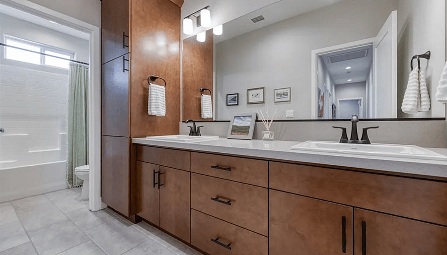 Shared bathroom, private sink and extra space under sink for personal effects, plus 1 drawer and 1 shelf in large cabinet.