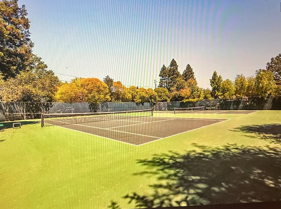 one of 2 tennis courts