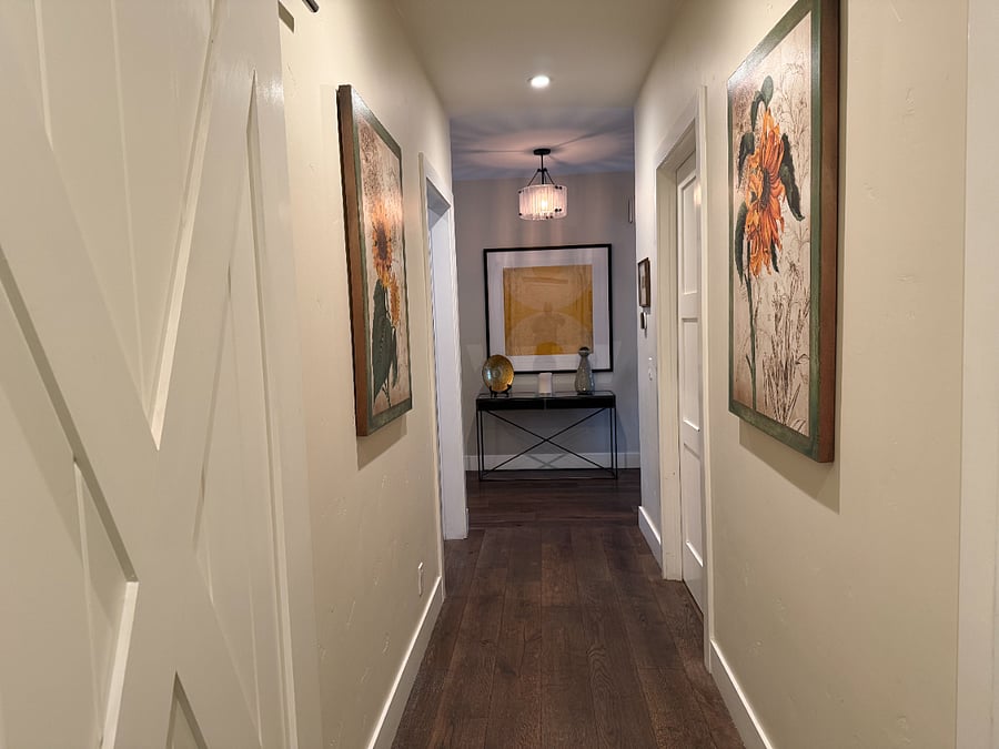 a look down the wide hallway- the barn door is the primary bedroom door