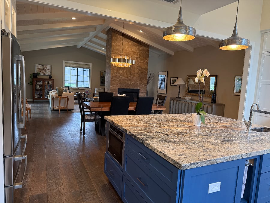 the cook has a great view of the connecting dining and living areas