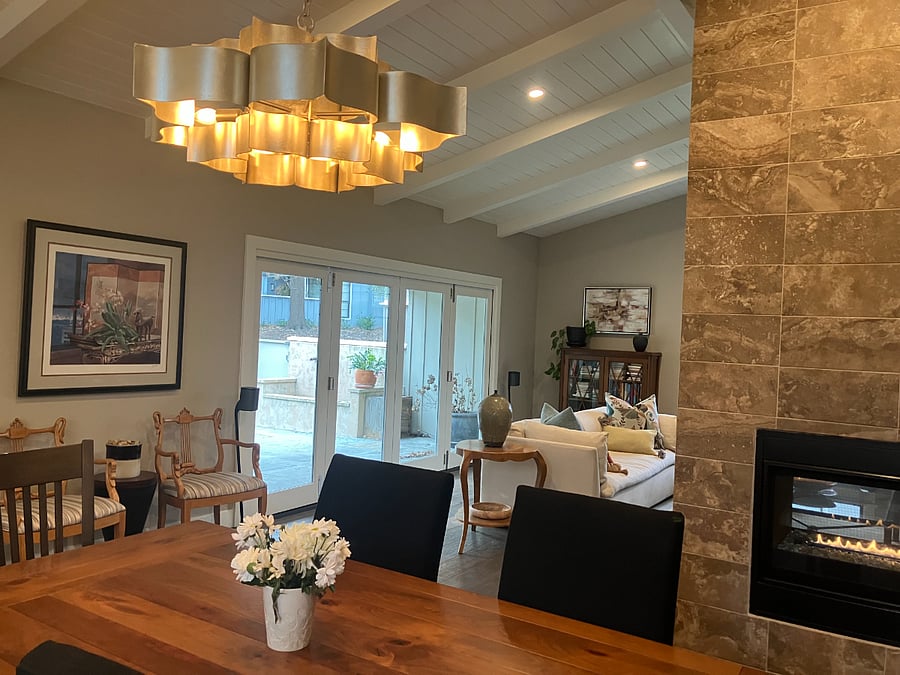 folding glass patio doors off the living room provides indoor/outdoor living