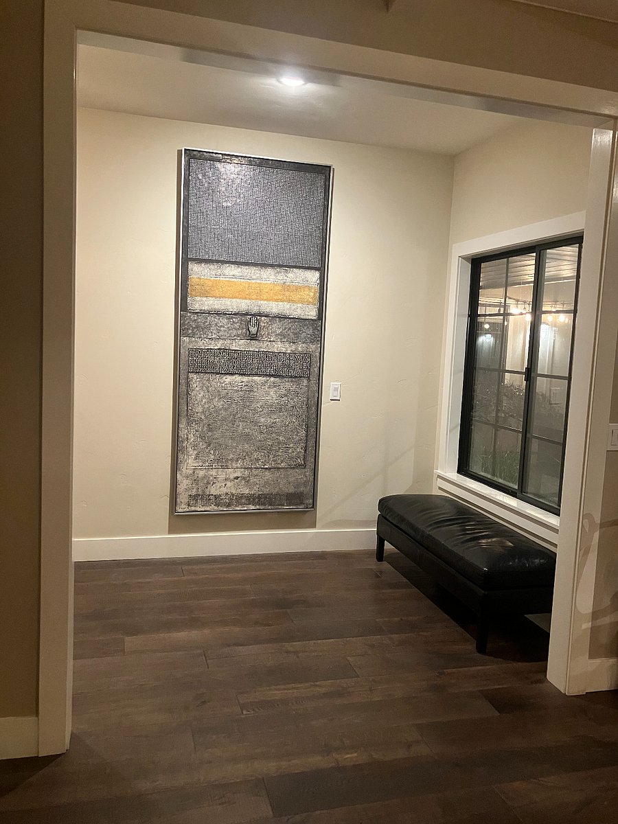 8 foot tall art is a focal point from the dining room