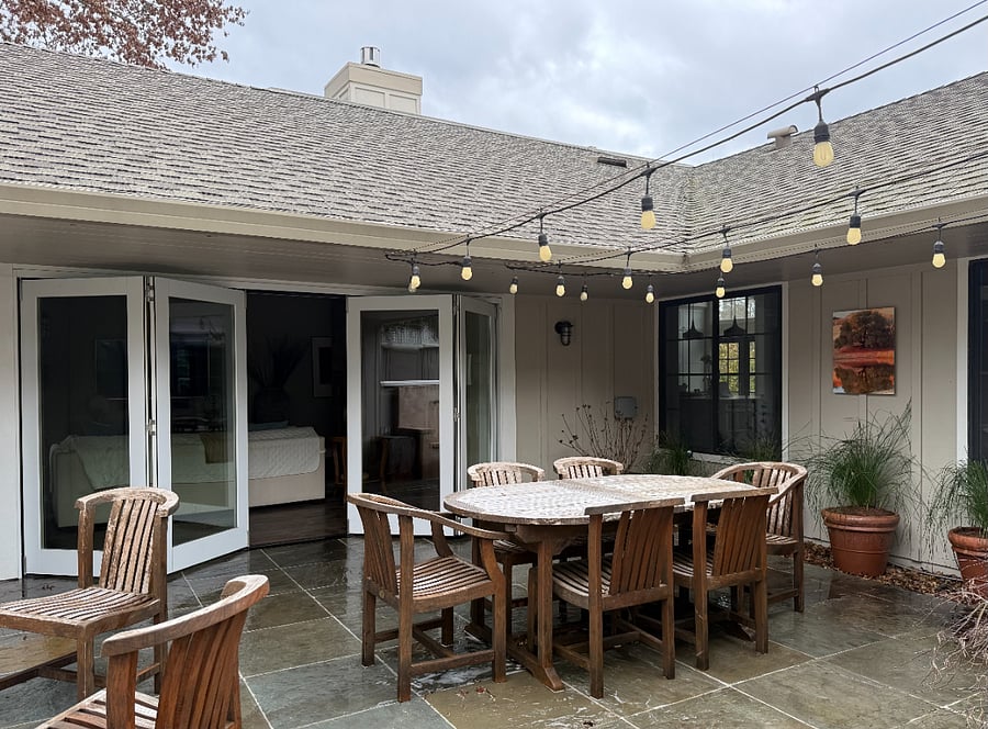 back courtyard and dining table seating up to 10, patio doors to living room