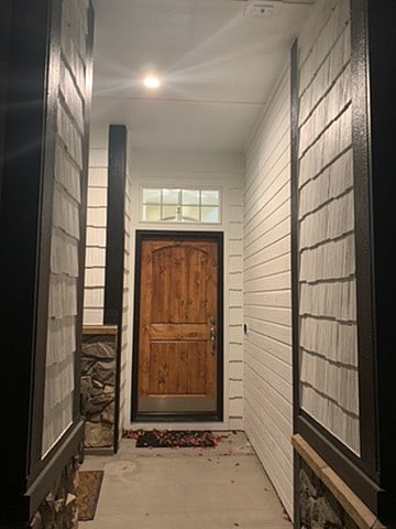 Front entrance lit and includes security cameras.