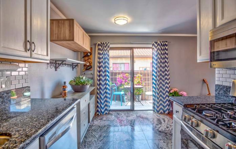 Private balcony off of kitchen 
Overlooks courtyard from second floor
