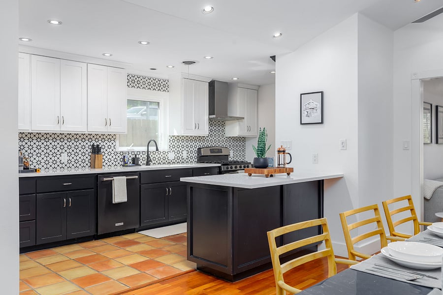 Fully equipped kitchen with sleek black & white design and all the essentialsperfect for morning brunch or evening feasts.