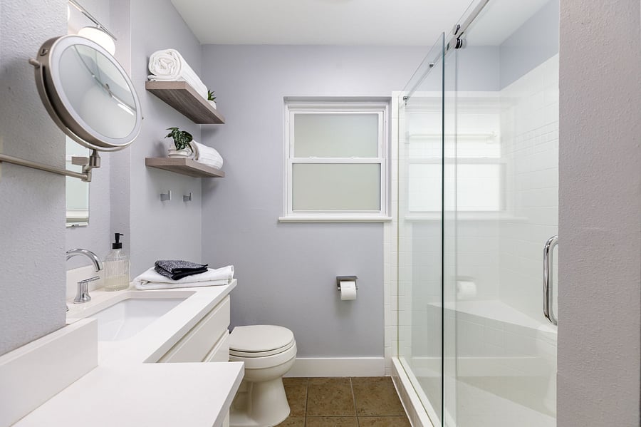Master bathroom includes a walk-in shower with plenty of convenient storage