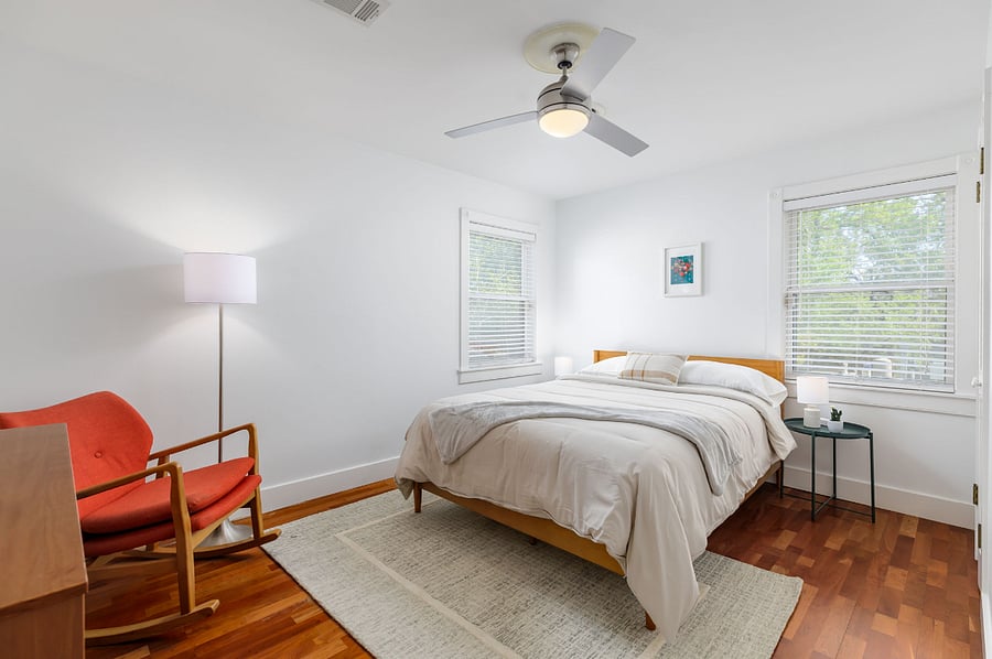 Mid-century charm and plenty of natural light make this bedroom a calm, restful escape after a day of exploring Austin.