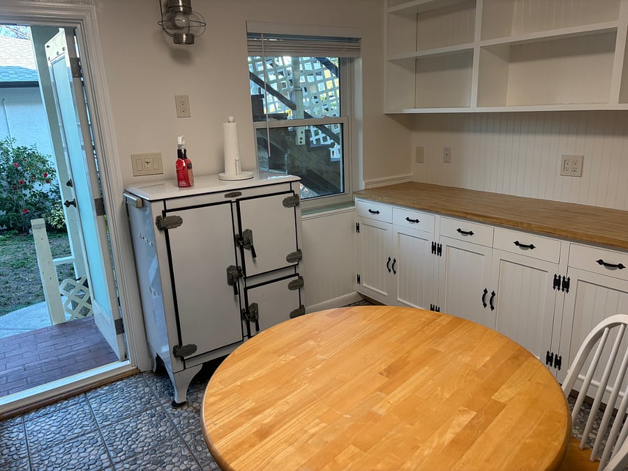 Kitchen table area and additional counter top space and storage