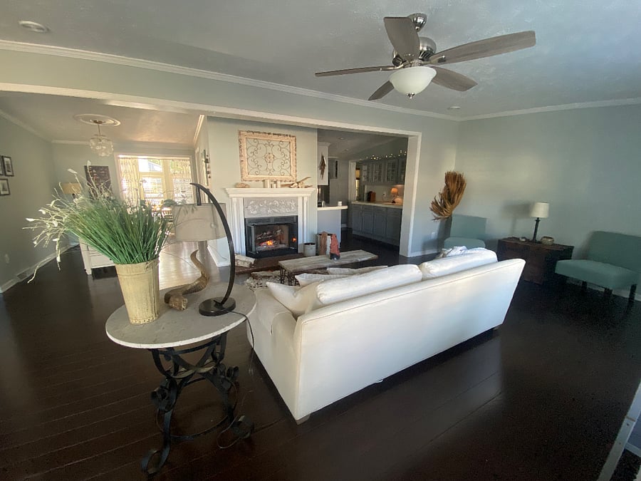 Living area with wood burning fireplace. 