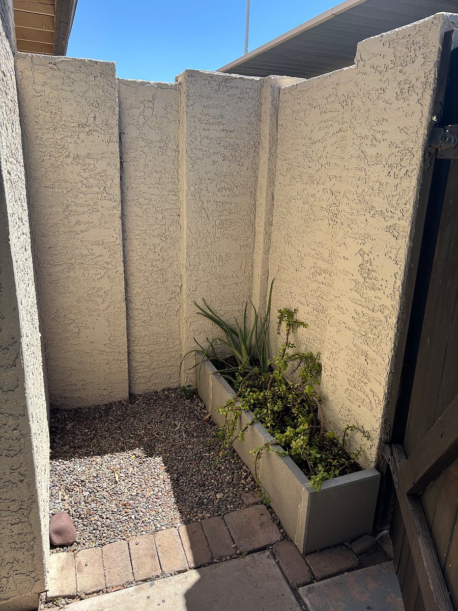 Two covered parking spaces outside back patio