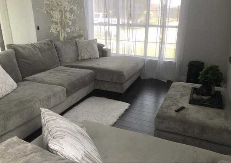 Vaulted ceiling in first living room with 85 inch smart tv