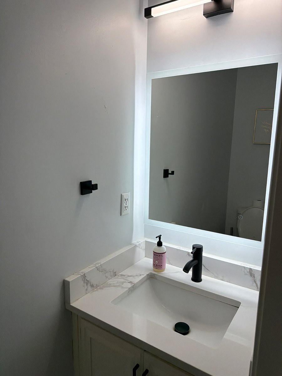 The guest bathroom downstairs with built-in Bluetooth speaker and LED lights