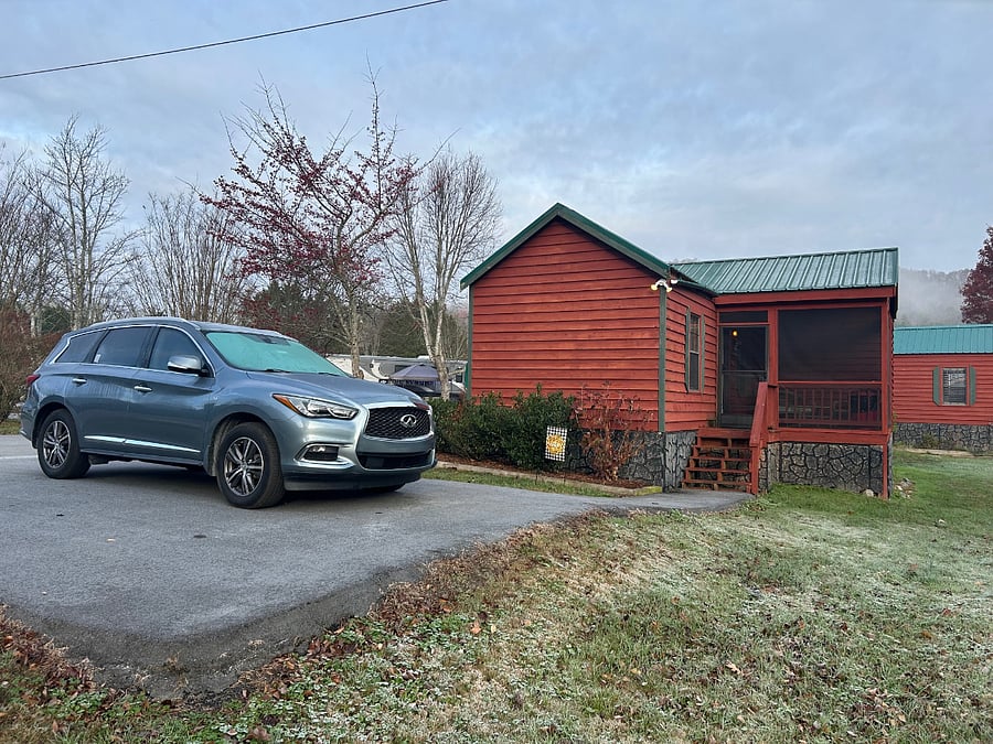 Side view and entrance to cabin. Four steps up, one level inside.