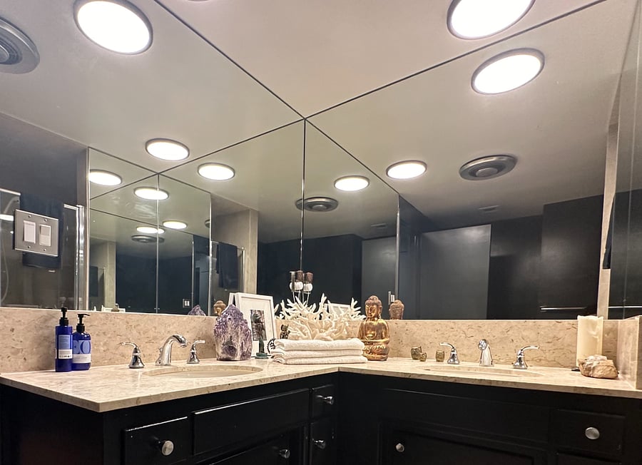 Full bathroom with shower, bathtub, two sinks, and ample counter space