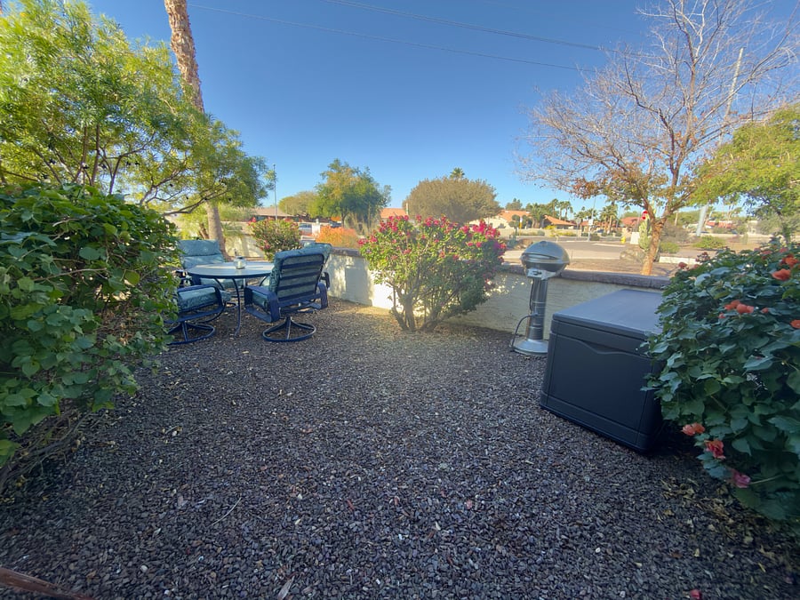 Outdoor area with patio table and BBQ