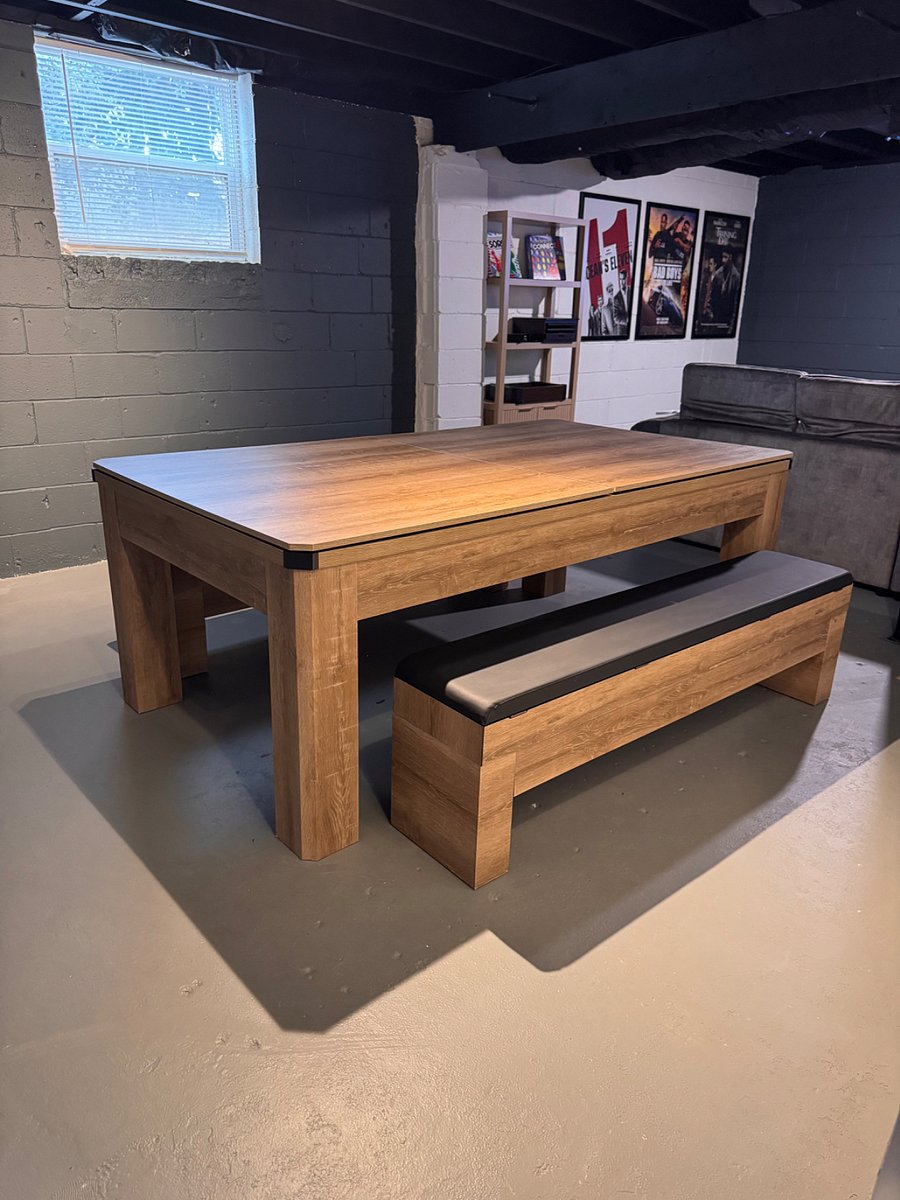 Versatile game room featuring a pool table that converts to ping-pong or a dining/card table.