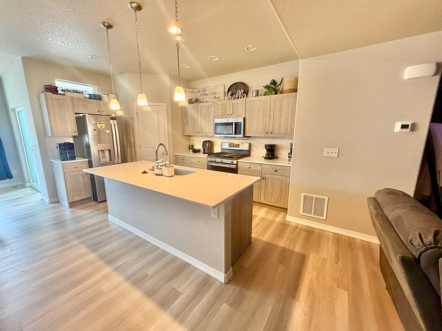 The kitchen offers a clean, modern feel with plenty of natural light and is fully stocked with quality cookware and essentialsideal for anyone who enjoys cooking and entertaining in a well-lit space.