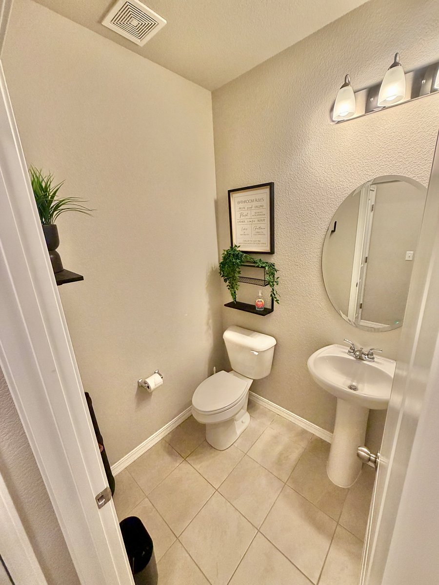 A thoughtfully located half bathroom on the second floor sits just off the living room and kitchen, enhancing functionality and comfort for both residents and guests.