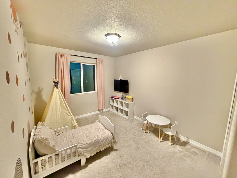Designed with younger children in mind, this cozy room includes a bed, closet, TV, and age-appropriate toys, offering a welcoming and playful space for little ones.