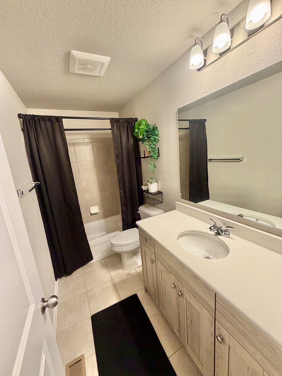 A full bathroom is located in the third-floor hallway, providing convenient access for the bedrooms on that level.